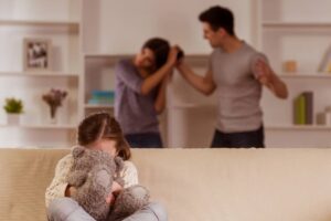 child suffering from quarrels between parents in the family at home